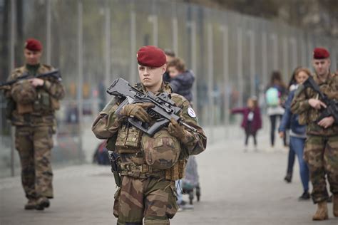 French Army soldiers of Operation Sentinelle patrol around the Eiffel Tower during Yellow Vest ...
