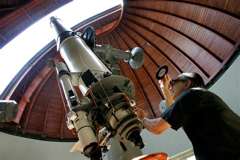 PRINT Father Emmanuel Carreira operates the telescope at the Vatican ...