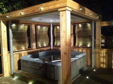 Enclosed hot tub area complete with lighting, privacy screens and curtains. The roof is also a ...