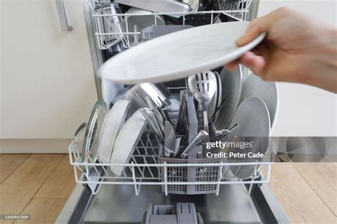 Unloading Dishwasher High-Res Stock Photo - Getty Images