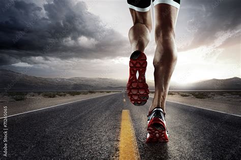 Sports background. Runner feet running on road closeup on shoe. Stock Photo | Adobe Stock