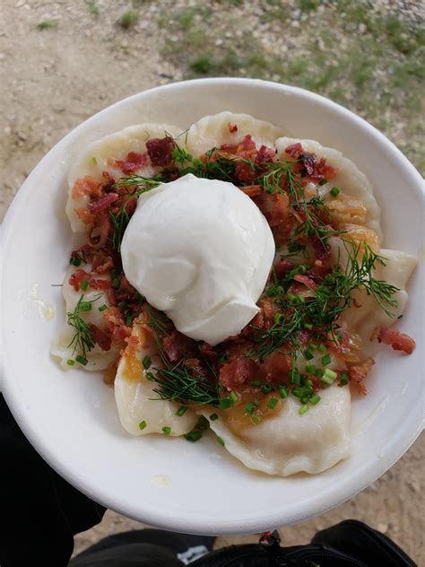 [I ate] Cheddar perogies with bacon, onions fresh dill and sour cream. : r/food