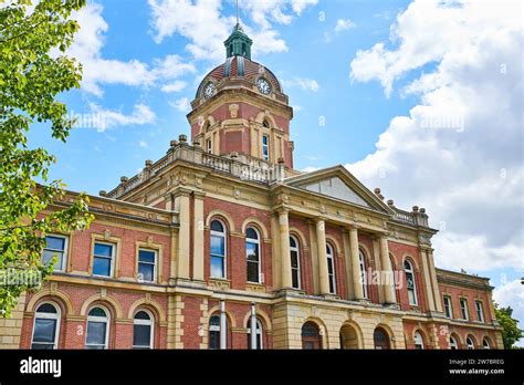 Front of Elkhart County courthouse on blue sky day with fluffy white clouds, summer, Indiana ...