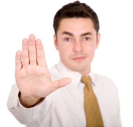 Business man doing a stop sign with his hand | Freestock photos