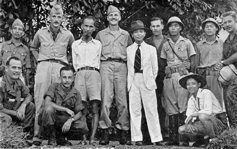 OSS Deer Team members pose with Viet Minh leaders Ho Chi Minh and Vo Nguyen Giap during training ...