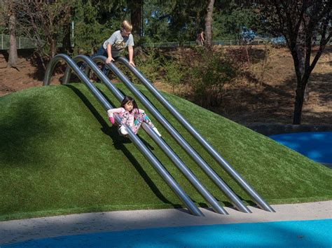 Embankment Banister Slide | Playground slide, Playground design, Playground