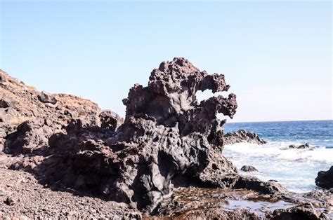 Premium Photo | Basaltic lava formation near the ocean coast