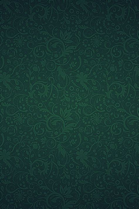 a dark green wallpaper with an intricate design