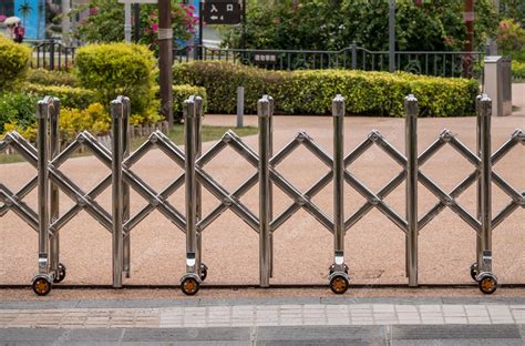 Premium Photo | Stainless steel expandable metal fence or barrier ...