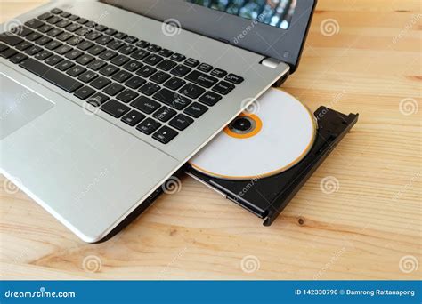 CD DVD Drive Writer Burner Reader Internal of Laptop Computer on Wooden Stock Photo - Image of ...