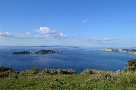 Blue Sky over Sea Coast with Islands · Free Stock Photo