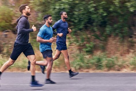 Premium Photo | Running fitness and men in a road for training speed ...