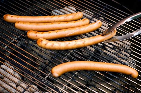 Wieners on a grill | Stock image | Colourbox