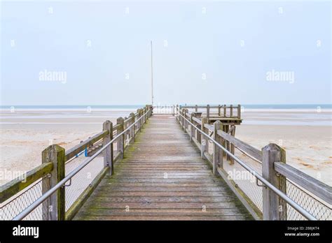 Weathered wooden lookout facing the sea at the empty beach of Norddorf ...