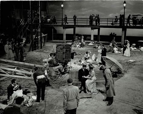 A VINTAGE PUBLICITY PHOTOGRAPH by EMMETT SCHOENBAUM depicting the cameraman, cast and crew on ...