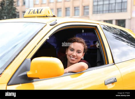 Female taxi driver in car Stock Photo - Alamy