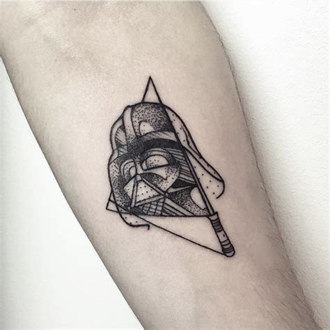 Geometrical style little black ink Darth Vader mask tattoo on forearm ...