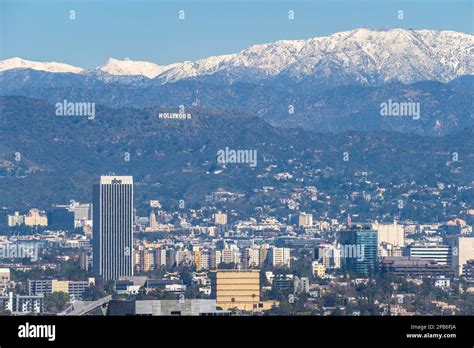 Los Angeles with snow covered mountains Stock Photo - Alamy