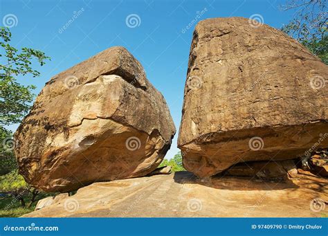 Ancient Monks Meditation Caves Under Big Rocks in Anuradhapura, Sri Lanka. Stock Photo - Image ...