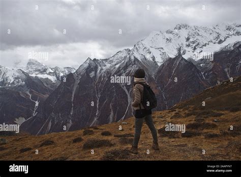 Western Woman in hiking gear trekking in the Langtang Valley region of the Himalayas Stock Photo ...