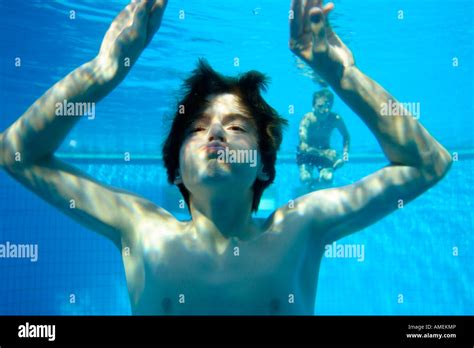 two young boys diving at an open air bath Stock Photo - Alamy