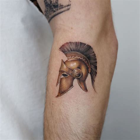 Trojan helmet tattoo by Mumi Ink - Tattoogrid.net