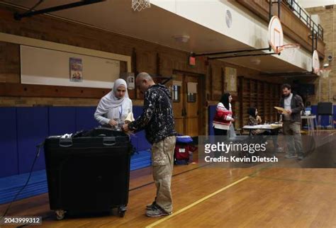 Voters Cast Their Ballot In The Michigan Presidential Primary Election ...