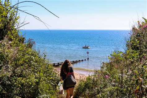 Swanage beach girl walking to sea2 – Swanage.co.uk