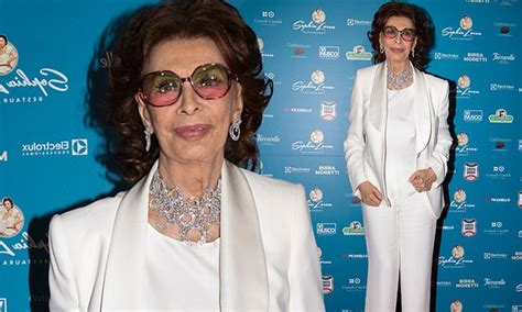 Sophia Loren, 88, looks more glamorous than ever in a chic white suit at her restaurant opening ...