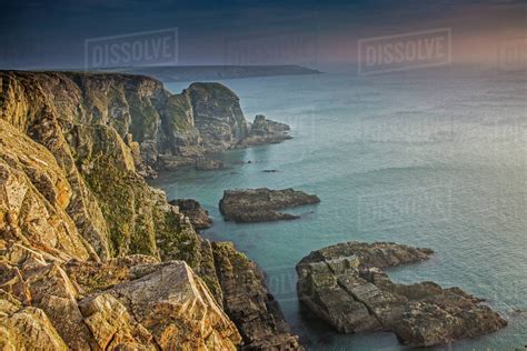 Craggy cliffs overlooking ocean, South Stack cliffs, Anglesey, Wales ...