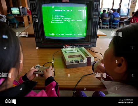 North Korean kids playong video games, Wonsan, North Korea Stock Photo ...