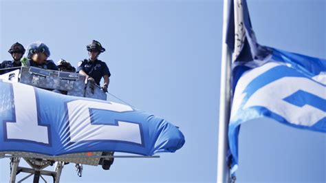 Photo Gallery - 12th Man Raising Flags