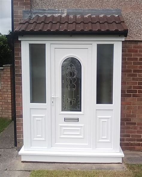 White upvc porch, with decorative panel door. Installed by Windseal Double Glazing based in ...