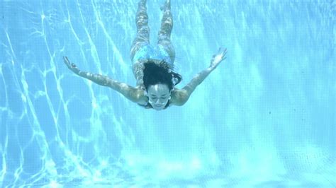 Girl Swimming Underwater In Swimming Pool Stock Footage SBV-308642434 - Storyblocks