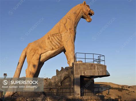 Peru, Stone statue of a Puma overlooking the city of Puno and Lake ...