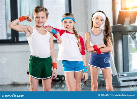 Adorable Kids in Sportswear Smiling and Posing at Fitness Studio Stock ...