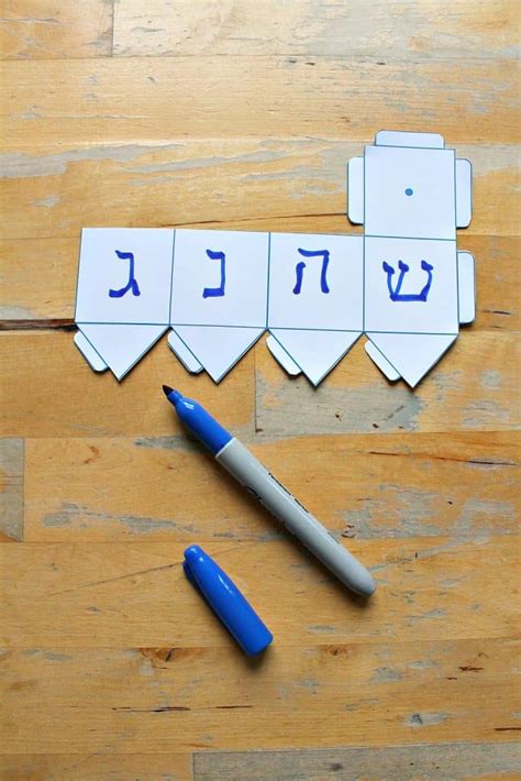 How to play dreidel with printable dreidel spinning top - NurtureStore