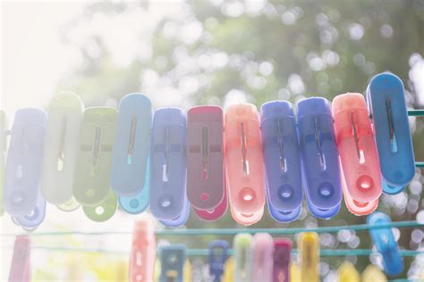 An image of very colorful clothes pegs on a clothesline 7449951 Stock Photo at Vecteezy