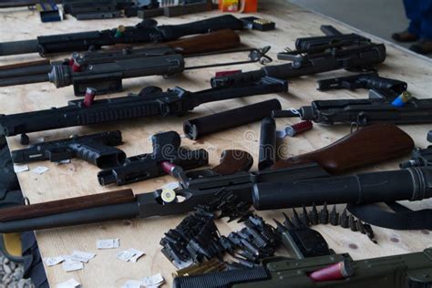 Table with Numerous Firearms Stock Image - Image of numerous, guns: 109169155