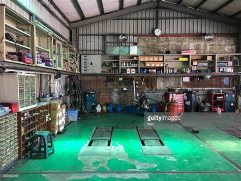 Stock Photo : Old Car Repair Shop Interior with Mechanic in Background ...