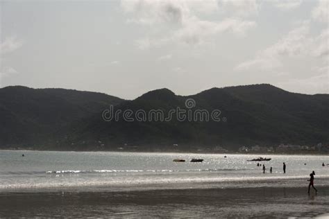 A Silhouette of a Child Playing on the Beach Stock Image - Image of ...