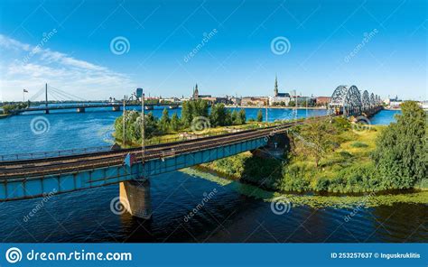 A Bridge Over River Daugava in Riga with a Train Passing by. Stock ...