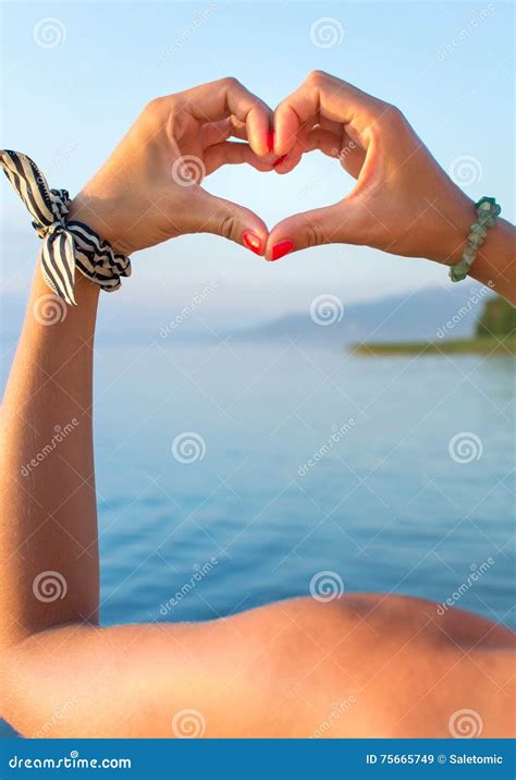 Woman Hands Making Heart Shape at the Beach Stock Image - Image of painted, hands: 75665749