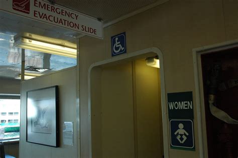Emergency Evacuation slide, wheelchair user sign, women wi… | Flickr