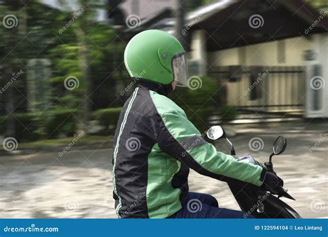 Young Motorcycle Taxi Driver with Green Helmet Stock Photo - Image of safety, male: 122594104