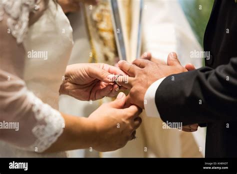 Bride and groom rings at the ceremony Stock Photo - Alamy