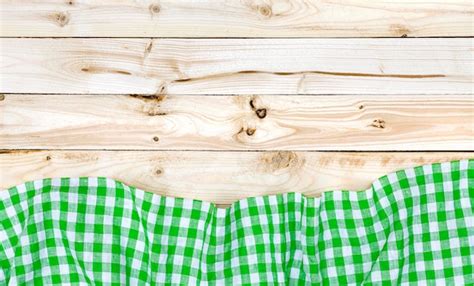 Premium Photo | Green tablecloth on wooden table top view