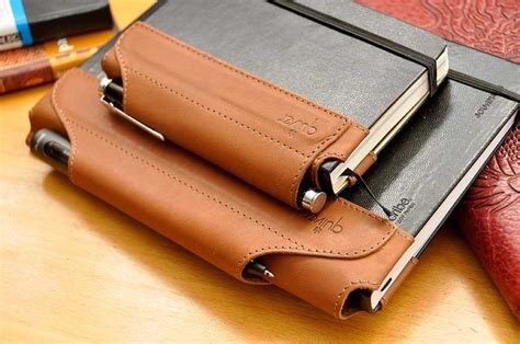 The Quiver pen holder for Moleskine notebooks. | Leather projects, Leather notebook, Leather books
