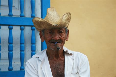 Man Wearing Straw Hat While Smoking · Free Stock Photo