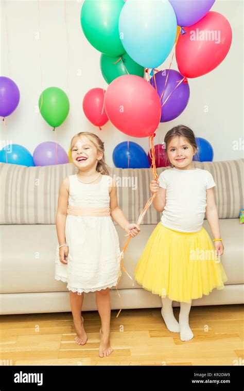 Two girls at birthday party Stock Photo - Alamy